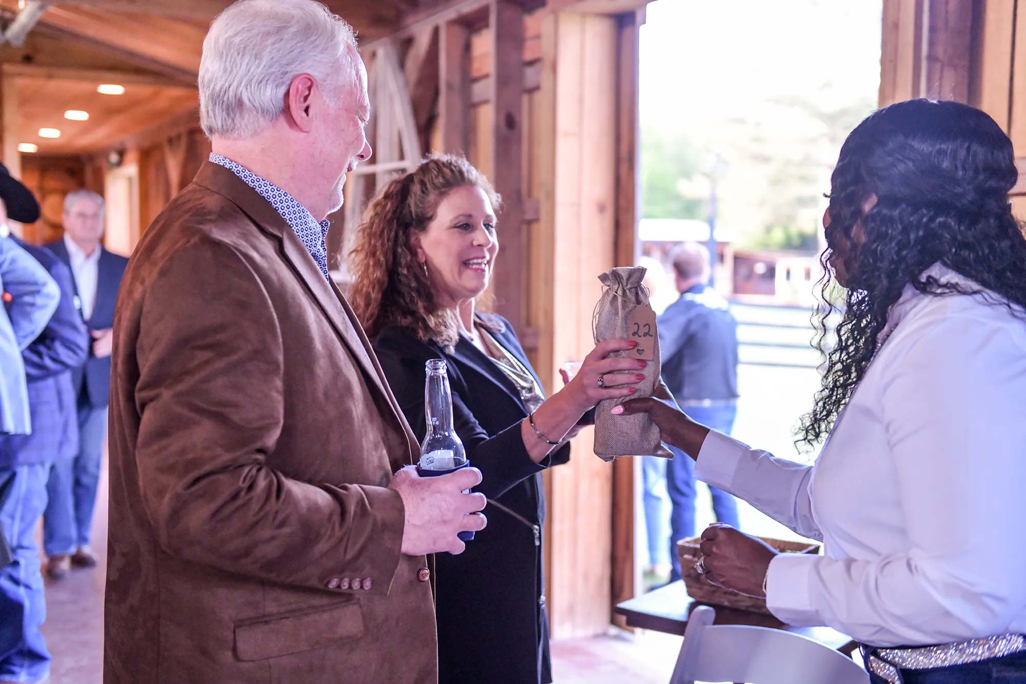 Well dressed lady receiving a prize